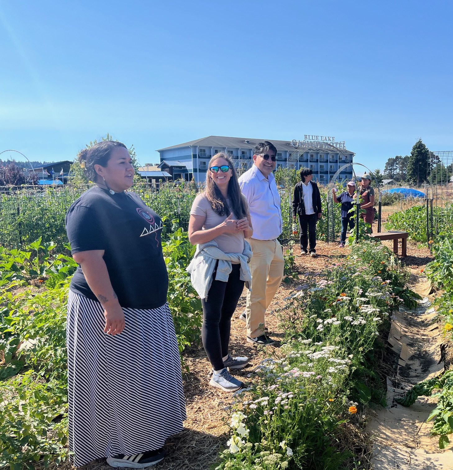 Task Force members walk through the Blue Lake Rancheria Daluviwi’ Community Garden with garden staff