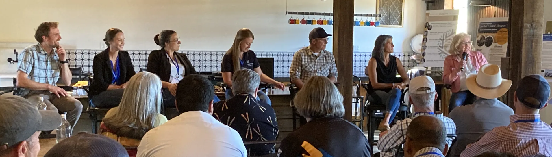 A group of people at a talk