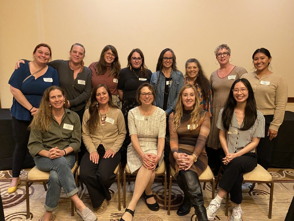 A photo of people posing in a group photo at a TCBP Peer Learning Session.